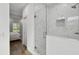 Modern bathroom with glass shower and marble tile at 524 S Grosse Ave, Tarpon Springs, FL 34689