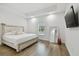 Bright bedroom with a king-size bed and wood flooring at 524 S Grosse Ave, Tarpon Springs, FL 34689