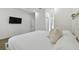 Bright bedroom with large bed and wood floors at 524 S Grosse Ave, Tarpon Springs, FL 34689