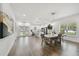 Modern dining area with large table and open concept kitchen at 524 S Grosse Ave, Tarpon Springs, FL 34689
