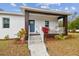 Modern home exterior featuring a covered porch and walkway at 524 S Grosse Ave, Tarpon Springs, FL 34689