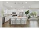 Bright kitchen featuring white cabinets, stainless steel appliances, and an island with seating at 524 S Grosse Ave, Tarpon Springs, FL 34689