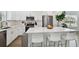Modern kitchen with white cabinets, stainless steel appliances and an island at 524 S Grosse Ave, Tarpon Springs, FL 34689