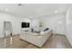 Spacious living area featuring a large sectional sofa and hardwood floors at 524 S Grosse Ave, Tarpon Springs, FL 34689