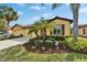 House exterior with palm trees and landscaping at 5527 Sunset Falls Dr, Apollo Beach, FL 33572