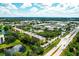 Aerial view of condo building and surrounding landscape, showing its location near a busy road at 5849 Park N St # 201, St Petersburg, FL 33709