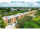 Aerial view of a condo building, showing its architectural style and landscaping at 5849 Park N St # 201, St Petersburg, FL 33709