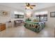 Bright bedroom with a large bed and tile floors at 5849 Park N St # 201, St Petersburg, FL 33709