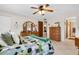 Spacious bedroom with a dresser and ceiling fan at 5849 Park N St # 201, St Petersburg, FL 33709