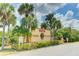 6000 Park Place Condominium entrance with lush landscaping and palm trees at 5849 Park N St # 201, St Petersburg, FL 33709