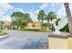 Community entrance sign for 6000 Park Place with landscaping and eagle statues at 5849 Park N St # 201, St Petersburg, FL 33709