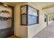 Condo entrance with wreath and window at 5849 Park N St # 201, St Petersburg, FL 33709