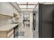 Kitchen with black appliances and white cabinets at 5849 Park N St # 201, St Petersburg, FL 33709