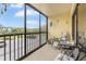 Screened balcony with chairs and table at 5849 Park N St # 201, St Petersburg, FL 33709