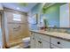 Bright bathroom featuring a walk-in shower and vanity with granite countertops, offering a fresh and clean aesthetic at 6367 Foxbrook Trl, Parrish, FL 34219