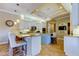 Modern kitchen with recessed lighting, eat-in bar, and stainless steel appliances at 6367 Foxbrook Trl, Parrish, FL 34219
