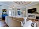 Cozy living room featuring a fireplace, modern lighting, and stylish decor at 6367 Foxbrook Trl, Parrish, FL 34219