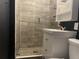 Modern bathroom with glass shower and pebble floor at 6614 Papa Guy Ln, Plant City, FL 33565