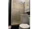 Modern bathroom with glass shower and pebble floor at 6614 Papa Guy Ln, Plant City, FL 33565