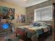 Bedroom with a bed, desk and Lilo and Stitch themed decor at 6614 Papa Guy Ln, Plant City, FL 33565