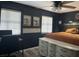 Bright bedroom with window blinds, a dresser, and a workspace at 6614 Papa Guy Ln, Plant City, FL 33565