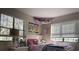 Cozy bedroom with a fun, playful design and lots of natural light at 6614 Papa Guy Ln, Plant City, FL 33565