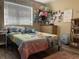 Bedroom with a bed, dresser and Stitch themed decor at 6614 Papa Guy Ln, Plant City, FL 33565