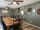Farmhouse-style dining room with a large wooden table and seating for twelve at 6614 Papa Guy Ln, Plant City, FL 33565