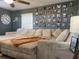 Living room with sectional sofa and gallery wall at 6614 Papa Guy Ln, Plant City, FL 33565