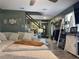 Living room with sectional sofa and view of staircase at 6614 Papa Guy Ln, Plant City, FL 33565
