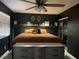 Main bedroom with king-size bed and dresser at 6614 Papa Guy Ln, Plant City, FL 33565