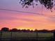 Vibrant sunset over a flat field at 6614 Papa Guy Ln, Plant City, FL 33565