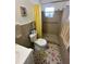 Bathroom with shower, toilet and a yellow curtain at 7524 Vienna Ln, Port Richey, FL 34668