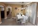 Bright dining area with white table and chairs, offering an open view at 7524 Vienna Ln, Port Richey, FL 34668