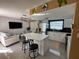 Modern kitchen with white cabinets, quartz countertops, and stainless steel appliances at 7524 Vienna Ln, Port Richey, FL 34668