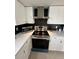 Stainless steel appliances and modern cabinetry in this updated kitchen at 7524 Vienna Ln, Port Richey, FL 34668