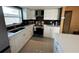 Modern kitchen with white shaker cabinets and stainless steel appliances at 7524 Vienna Ln, Port Richey, FL 34668