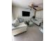 Bright living room with comfortable seating, a large TV, and access to the pool at 7524 Vienna Ln, Port Richey, FL 34668