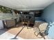 Pool area with covered patio, bar and seating at 7524 Vienna Ln, Port Richey, FL 34668