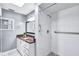 Updated bathroom with granite countertop, walk-in shower, and grab bars at 8532 Kumquat Ave, Seminole, FL 33777