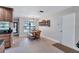 Bright dining area with wooden table and bench seating at 8532 Kumquat Ave, Seminole, FL 33777