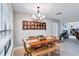 Charming dining room with a wooden table and bench seating at 8532 Kumquat Ave, Seminole, FL 33777