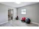 Home exercise room with wood-look floors and space for equipment at 8532 Kumquat Ave, Seminole, FL 33777