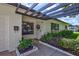 Stylish front entry with pergola and well-maintained landscaping at 8532 Kumquat Ave, Seminole, FL 33777