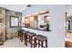 Kitchen features granite countertops and wooden cabinets at 8532 Kumquat Ave, Seminole, FL 33777