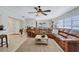 Bright and airy living room featuring a comfortable sectional sofa at 8532 Kumquat Ave, Seminole, FL 33777