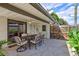 Outdoor patio space with seating area and access to the backyard at 8532 Kumquat Ave, Seminole, FL 33777