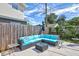Spacious patio with comfortable seating and outdoor umbrella at 8532 Kumquat Ave, Seminole, FL 33777