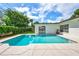 Inviting turquoise pool with expansive patio at 8532 Kumquat Ave, Seminole, FL 33777