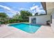 Inviting rectangular pool surrounded by a spacious patio at 8532 Kumquat Ave, Seminole, FL 33777